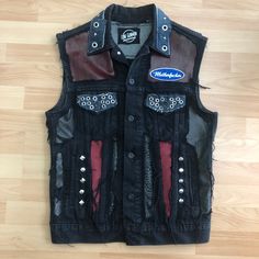 Denim Hard Rock Punk vest made by Lone Gunman Clothing. Leather and denim patchwork for a unique rock n roll look. Hours of details for this one of a kind piece. The bozo backprint is cut out of an offical merchandise product. Size Medium. Armpit to armpit approx 48cm. Punk Style Denim Vest For Fall Streetwear, Punk Denim Vest For Fall Streetwear, Edgy Fitted Vest For Festivals, Punk Style Vest For Streetwear In Fall, Black Rocker Style Vest For Streetwear, Edgy Denim Vest For Fall Streetwear, Black Denim Vest For Fall, Edgy Vest For Alternative Fashion In Fall, Edgy Fall Vest For Alternative Fashion