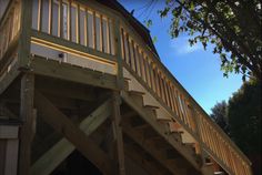 a wooden deck with stairs leading up to it