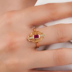 About this item Introducing the exquisite Vintage Red Gemstone in Real Gold, designed to captivate with its stunning allure and timeless elegance. Crafted with utmost precision, this exquisite piece is perfect for those seeking a symbol of eternal love and commitment 𝐈𝐭𝐞𝐦 𝐃𝐞𝐭𝐚𝐢𝐥𝐬 * Gold KT: 10K, 14K, 18K * Custom Gold Color: Rose Gold, Yellow Gold, White Gold * Width of Band: 3.00MM * Thickness of Band: 1.45MM 𝐆𝐞𝐦𝐬𝐭𝐨𝐧𝐞 𝐃𝐞𝐭𝐚𝐢𝐥𝐬 * Ruby * Total CTW: 0.56ctw WHY COSMIC FINE JEWELRY? ✓ Crafted with precision by skilled artisans with 10 years of experience in fine jewelry craftsmanship ✓ Uncompromising on quality to ensure customer satisfaction with every piece ✓ Exudes elegance and sophistication, perfect for special occasions or everyday wear ✓ Thoughtfully packaged i Ruby Gold Ring, Gold Ruby Ring, Ruby Ring Vintage, Red Gemstone Ring, Ruby Ring Gold, Ring Ruby, Ring Art Deco, Red Gemstones, 18k Gold Ring