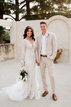 a bride and groom posing for a photo