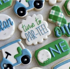 decorated cookies are displayed on a table with the words time to par - tee