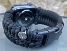 "FREE USPS PRIORITY MAIL SHIPPING FOR DOMESTIC US ORDERS (Includes U.S. Military APO/FPO Address Overseas) Thank you for visiting our shop \"Cording 2U\". A veteran owned business. Handcrafted Paracord wearables customized \"According To You\". Handcrafted with 100% Nylon Paracord \"MADE IN USA\" Our Products include: 🔹Custom handcrafted watch bands according to your wrist size, style, and color of choice. If you don't see it in our page yet, please contact us and we can discuss your options. ? Adjustable Black Apple Watch Band For Outdoor, Adjustable Black Watch Band For Outdoor, Adjustable Black Watch Bands With Custom Hardware, Durable Adjustable Apple Watch Band For Outdoor, Outdoor Apple Watch Band, Black Paracord Bracelet Strap Watch Band, Custom Black Watch Bands For Outdoor, Custom Black Outdoor Watch Bands, Adjustable Durable Black Apple Watch Band