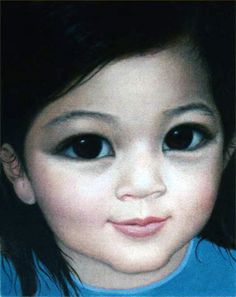 a close up of a child's face with black hair