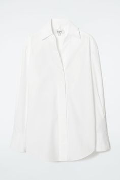 In a fresh take on classic shirting, the COS womenswear team designs this piece with exaggerated proportions. It's crafted from soft Pima-cotton poplin and features a pointed spread collar, a wide, concealed placket and slender waist ties that can be tied at the front or back, lending definition to the oversized shape. Oversized fitButton closure Shell: 100% Pima Cotton. Excluding trims / Machine wash Back length of size 6 is 31.49" / Model wears a size 6 Modern Lapel Collar Top For Office, Modern Tops With Concealed Placket, Modern Tops With Lapel Collar For Office, Relaxed Fit Poplin Top For Work, Chic Cotton Blouse With Lapel Collar, Spring Cotton Blouse With Concealed Placket, Modern White Blouse With Concealed Placket, Summer Poplin Top With Spread Collar, Modern Office Top With Lapel Collar