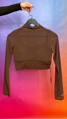 Introducing the Lucid Tan Top from YULY 360, a stunning long-sleeve mesh crop top that redefines versatility in your wardrobe. Available in classic shades of brown, black, and white, this top seamlessly transitions from day to night, making it a must-have for any occasion. Crafted with high-quality mesh fabric, the Lucid Tan Crop features a built-in bra that provides exceptional support, ensuring you feel confident and comfortable whether you're hitting the gym or heading out for a night on the Fitted Crop Top With Sheer Sleeves For Fall, Sheer Sleeves Fitted Crop Top For Fall, Sheer Cropped Mesh Top For Fall, Chic Crop Top With Sheer Sleeves For Fall, Trendy Cropped Mesh Top, Long Sleeve Crop Top For Night Out In Fall, Fall Crop Top With Sheer Sleeves, Long Sleeve Mesh Top For Layering, Chic Sheer Long Sleeve Crop Top