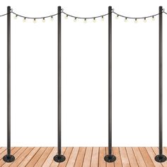 three black poles with lights on them in front of a wooden floor and white background