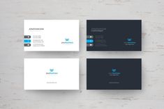 three business cards on top of each other with blue and gray accents, one in the middle