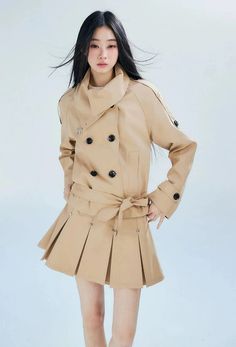 Reinvent your outerwear collection with this edgy Double-Breasted Cropped Trench Coat, a chic staple that transforms any look. 

Meticulously crafted from a soft, comfortable fabric, this trench coat sports a double-breasted front and a dynamic cropped silhouette. The chic khaki shade and pleated detailing add a touch of sophistication and texture, ensuring a nonchalant yet professional demeanor. 

This versatile piece pairs effortlessly with a high-waisted skirt or slim-fitting trousers, perfec Trench Coat With Skirt, Coat With Skirt, Cropped Trench Coat, Coat With Belt, Trench Coat Style, The Chic, Outerwear Women, Double Breasted, High Waisted Skirt