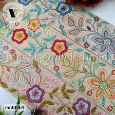 A very Beautiful and colorful floral Embroidery Trim on nylon net Fabric. High End Quality beautiful rich look thread and sequins work embroidered on pastel color net fabric. Length: 9 yard  Width:  Approx. 2.5" ( 6 cm) ( Refer Photo) Ideal for Dupatta, Lehenga, Skirts, Tops, Sari Blouse and other Indian Clothing It can also be used to make Embroidered Fabric Ribbon, Jewelry making, Table Runner border, Art Quilts, Embroidered Bags, Crazy Quilt,  Sewing Accessories, Summer Dress, Handbags, Wall Multicolor Bohemian Fabric For Festivals, Bohemian Multicolor Fabric For Festivals, Bohemian Multicolor Festival Fabric, Bohemian Beige Embroidered Fabric, Multicolor Bohemian Embroidered Fabric For Festivals, Bohemian Embroidered Fabric With Multicolor Border, Embroidered Multicolor Fabric For Festivals, Bohemian Multicolor Festive Fabric, Traditional Multicolor Summer Fabric