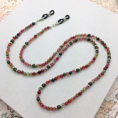 This handmade convertible chain can be used to hold your eyeglasses, sunglasses, or your mask! I strung each bead by hand! Measures approximately 29 1/2" (weighs .75 oz.) Great news! When you purchase more than one item in the same order, each additional item will ship for FREE! Shop my store: www.etsy.com/shop/MyCraftyCollectibles ALL SALES ARE FINAL - NO REFUNDS OR EXCHANGES. Thank you! Your purchase includes one glasses chain. The eyeglasses are not included. Photo decorations are not included. Sunglasses Necklace, Eyeglass Strap, Sunglass Chain, Photo Decor, Eyeglass Holder, Glasses Chain, Eye Wear Glasses, Agate Beads, Eyewear Sunglasses