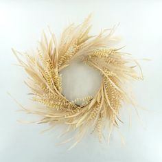 an image of a wreath made out of dried wheat