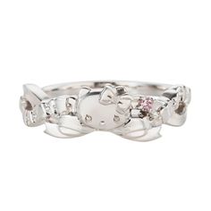 a white gold ring with pink stones in the center and an elephant on it's side