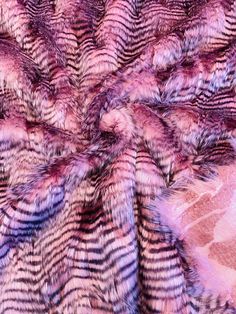 an animal fur texture is shown in pink and purple