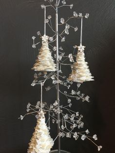 a small christmas tree made out of shells