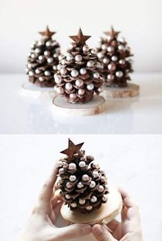 the pine cone is decorated with pearls and stars