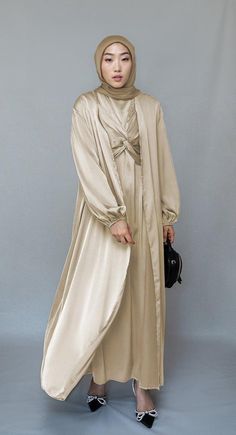 Aigerim 2 piece luxury 2 piece abaya with wrap bodice in beige - ANNAH HARIRI Elegant Beige Floor-length Sets, Floor-length Beige Abaya For Eid, Cream Long Abaya For Eid, Elegant Solid Color Abaya For Eid, Elegant Long Beige Abaya, Elegant Cream Long Sleeve Abaya, Elegant Long Sleeve Cream Abaya, Cream Abaya For Eid, Elegant Beige Abaya For Eid