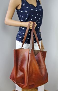 Brown large bag, Cognac brown owersized tote bag. Dimension details:Max width at the top: 60 cm / 23.6"Height: 35 cm / 13,5"Depth:25 cm / 10"Handle drop: 29 cm / 11,5" Brown Over sized city type bag.Adorable and very fashionable this season  large bag will make you feel special with her.A large, spacious bag for carrying books, laptops or shopping. The bag is so beautiful that you can just wear it empty, because it is soft and very pleasant in the end. The distressed leather's softened skin will Brown Tote-shaped Bucket Bag For Daily Use, Brown Bucket Tote Bag For Daily Use, Brown Tote Bucket Bag For Daily Use, Large Brown Rectangular Bag, Large Rectangular Brown Bag, Large Brown Bags With Double Handle, Large Brown Shoulder Bag For Travel, Large Brown Rectangular Shoulder Bag, Large Brown Bag For Everyday Use