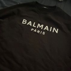 Balmain Sweater Black Xl Luxury Winter Sweatshirt With Letter Print, Luxury Crew Neck Sweatshirt With Letter Print, Luxury Tops With Logo Detail For Fall, Luxury Logo Tops For Fall, Luxury Logo Detail Tops For Fall, Luxury Logo Print Tops For Winter, Luxury Logo Print Winter Tops, Luxury Black Top With Logo Print, Classic Black Tops With Logo Detail