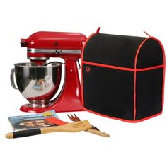 a red mixer and utensils are sitting next to a black bag on a white background