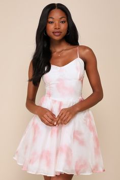 Get ready to charm your way through every event in the Lulus Exceedingly Adorable Ivory and Pink Chiffon Bustier Mini Dress! Sleek, lightweight woven chiffon boasts an artistic pattern of pink and white (with an ultra-subtle rose print running throughout) as it shapes adjustable spaghetti straps and a sweetheart neckline. Bustier-style bodice has seamed cups and a high, fitted waist. Skirt has a ballroom-ready, skater silhouette, with a hidden layer of tulle for volume and a mini hem. Smocked pa Bustier Mini Dress, Pink Tulle Dress, Casual Formal Dresses, Lulu Fashion, Chiffon Mini Dress, Pink Chiffon, Casual Wedding Dress, Pink Tulle, Rose Print