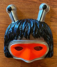 Welcome to Bobby's vintage Fun & Dime! For your consideration is a vintage Bugaloo IQ Halloween costume mask produced by Ben Cooper in the 1970s. This is unused and sources from a warehouse find of old, uncirculated masks and other costume components. It is in fantastic condition although the elastic bands have broken. Please be aware that while these are unused and in great shape, they are delicate, vintage items! Vintage Halloween Costume Masks And Prosthetics, Vintage Masks For Halloween Costume Party, Vintage Halloween Costume Party Masks, Vintage Black Masks And Prosthetics For Costume Party, Vintage Black Mask And Prosthetics For Costume, Vintage Masks For Costume Party, Vintage Halloween Masks And Prosthetics For Costume Party, Vintage Masquerade Costume Accessories For Halloween, Vintage Masks For Carnival Costume Party