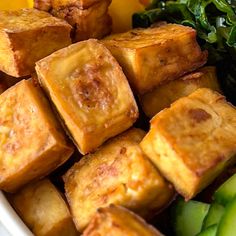 tofu and vegetables in a white bowl on a table