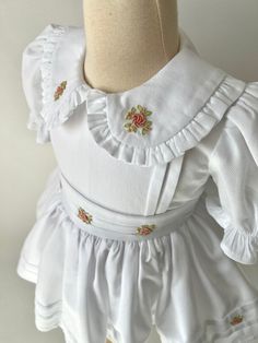 ✿ABOUT THIS DRESS ✓Our hand-embroidery dress is made from high-quality cotton fabric, this dress features a fluffy tutu-supported skirt lined with soft cotton for ultimate comfort. ✓The frilled collar and rib impositions on the front part of the dress and skirt add a touch of elegance, while the bow tie belt accentuates your child's waistline for a flattering fit.  ✓Every flower embroideries adorning the dress - each hand-crafted with exquisite attention to detail by our skilled artisans. ✿FABRI Fitted Floral Embroidery Dress With Doll Collar, White Doll Collar Dress With Floral Embroidery, White Floral Embroidery Dress With Doll Collar, Embroidered Cotton Dress With Doll Collar, Embroidered Cotton Dresses For Baptism, Embroidered Long Sleeve Baptism Dress, Cotton Embroidered Dress With Doll Collar, Cotton Embroidered Dress For Baptism, Cute Embroidered Fitted Sets