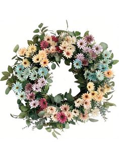 a wreath made out of flowers and leaves