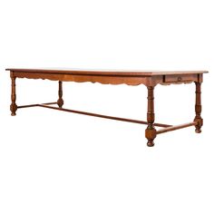 an old wooden table with two drawers on one end and a shelf at the top