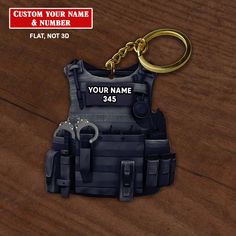 a personalized police vest keychain on a wooden surface