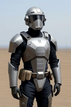 a man in a futuristic suit standing on top of a dirt field with his hands in his pockets