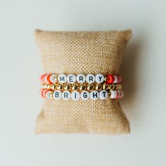 * Festive Christmas bracelet stack * Show your Christmas spirit with our MERRY & BRIGHT stack * Lightweight & easy to wear stretch bracelets * Handmade in North Carolina * Perfect for holiday parties, stocking stuffers, and White Elephant gift exchanges! * Custom sizes available  Click to see our entire Christmas Collection: https://www.etsy.com/shop/KelseyOBrienDesigns?ref=seller-platform-mcnav&section_id=39995916 ---SIZING--- Select your desire size from the drop down menu. Don't see your desi Cheap White Bracelets For Christmas, Cheap Beaded Bracelets For Holiday, Festive Adjustable Personalized Bracelets, Holiday Jewelry With Letter Beads, Holiday Jewelry With Letter Round Beads, Holiday Jewelry With Round Letter Beads, White Letter Beads Bracelets For Holidays, Christmas Beaded Stretch Bracelet Gift, White Beaded Bracelets With Letter Beads For Christmas