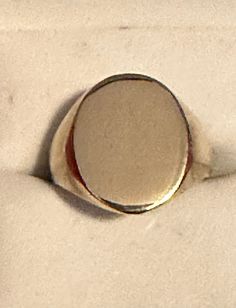 A very vintage 10K yellow gold signet ring for your consideration.  The ring is hallmarked 10K along with the maker's mark, SCD, and guaranteed to such.  It features a blank signet which can be engraved by its new owner. The top of the ring measures 17.5mm x 14mm.  The sides are a tapered and polished.  This fabulous pieces is a size 8 1/4 and weighs 3.95 grams.  It a fabulous piece of history with lots to be made! Classic Hallmarked Signet Ring For Collectors, Classic Hallmarked Signet Ring Collectible, Classic Yellow Gold Signet Ring With Maker's Mark, Gold Round Signet Ring With Maker's Mark, Gold Signet Ring With Maker's Mark, Gold Oval Signet Ring With Maker's Mark, Classic White Gold Signet Ring Collectible, Classic Oval Signet Ring Collectible, Classic Silver Signet Ring With Maker's Mark