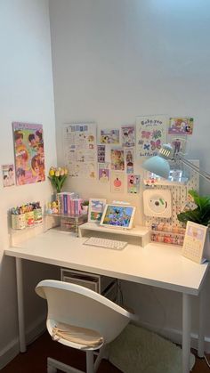 a white desk topped with a laptop computer