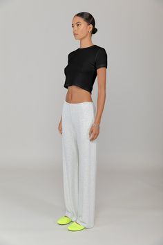 Cut in our stretch cotton rib, The Kelly Crop Slim Fit Tee is a modern classic. Featuring a classic crew neckline and cropped length, this is the perfect pair for a high waisted pant. Casual Stretch Bottoms With Cropped Hem, Versatile Relaxed Fit Crop Top For Loungewear, Casual Solid Cropped Pants, Stretch Cropped Bottoms For Loungewear, Casual Solid Color Cropped Pants, Solid Cropped Loungewear Pants, Solid Cropped Pants For Loungewear, Relaxed Fit Cropped Tops With Elastic Waistband, Cropped Relaxed Fit Tops With Elastic Waistband