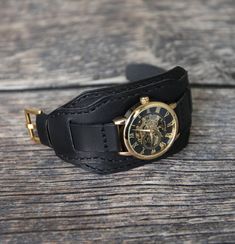 Leather watch band for men. Suitable for watches with lug widths 18mm, 20mm, 22mm, 24mm. The strap is matte black. Made in full grain Badalassi leather bund band. Bund strap military, medium soft, dense, durable, multifunctional, comfortable, pleasant to the touch looks beautiful on a man's hand. Handmade cuff watch strap is a good last minute gift for men.  Bund band design Watch strap with cuff. The two piece watch band is made of one layers of leather, flat, unlined. The cuff is removable is Vintage Black Watch Accessories With Leather Strap, Handmade Black Leather Watch Accessories, Handmade Black Watch For Everyday Use, Black Leather Cuff Watch Bands, Handmade Black Watches For Everyday Use, Black Cuff Bracelet Watch Band, Black Cuff Bracelet Strap Watch Accessories, Black Cuff Watch Band For Gift, Black Cuff Watch Band As Gift