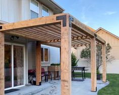 an outdoor patio with wooden pergols and chairs