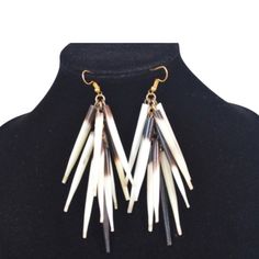 African porcupine quill earrings. This Porcupine quill earrings is made from genuine African porcupine. This porcupine quill earrings has a unique eye-catching layered design with a natural mix of brown and white shades. No animals were harmed for their porcupine quills. These are NATURALLY shed porcupine quills from Kenya porcupines and collected without any harm to the porcupine. Porcupine Quill necklace are also available for matching pieces.   - Length (including hook) - 3.5inches/9cms.   For matching necklace within the store, check out the link below https://www.etsy.com/listing/708493395/african-porcupine-quill-tribal-necklace?ref=shop_home_active_59&frs=1&sca=1 Porcupine Quill Porcupine Earrings African Porcupine Nature Jewelry Porcupine Quill Earrings, Quill Earrings, Fulani Earrings, African Inspired Jewelry, Porcupine Quills, African Print Clothing, Jewelry Nature, White Shades, Lucky Elephant