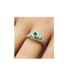 This exquisite vintage ring features a stunning simulated emerald set in anti-tarnish rhodium plated 925 solid sterling silver. The intricate filigree design adds a touch of elegance to the piece, complemented by the simulated emerald accent stones. You can find the 925 stamp on the ring, indicating its high quality and authenticity. Emerald Set, Cocktail Jewelry, Jewelry Elegant, Filigree Design, Filigree Ring, Green Gemstones, Multi Stone Ring, Vintage Ring, Birthday Present