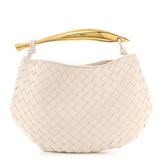 This is an authentic BOTTEGA VENETA Nappa Intrecciato Sardine Bag in Chalk. This stylish shoulder bag is crafted of intrecciato tightly woven white lambskin leather. The bag features a gold sardine shaped top handle. The open top leads to a matching woven leather interior. Designer Handheld Shoulder Bag With Intrecciato Weave, Elegant White Hobo Bag With Leather Handles, Elegant Shoulder Bag With Braided Round Handles, Formal Intrecciato Weave Tote Bag, Luxury Bags With Braided Round Handles, Luxury Shoulder Bag With Braided Handles, Designer White Bag With Round Handle, White Bags With Leather Handles For Formal Occasions, White Formal Bags With Leather Handles