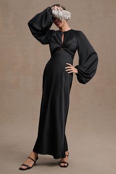 A slim midi silhouette boasts full-length balloon sleeves and twisted-front detailing to create an enchanting statement. An alluring open back and center front cutout set the Significant Other Demi Long-Sleeve Column Gown apart. | Demi Backless Long-Sleeve Column Gown by Significant Other in Black, Women's, Size: 4, Polyester/Rayon/Elastane at Anthropologie Long Sleeve Bridesmaid Dress, Black Bridesmaids, Black Tie Dress, Guest Attire, Wedding Attire Guest, Black Bridesmaid Dresses, Column Gown, Little White Dresses, Significant Other