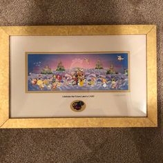 a framed disney movie poster on the floor