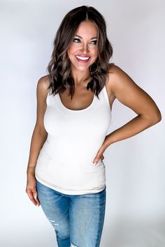 Stay stylish and comfortable with The Everything 2 Way Seamless Tank. This versatile tank features stretchy material that can be worn as a scoop neck or reversed to a v-neck for a customizable look. Plus, it can be stretched long or worn in a shorter length. Perfect for any wardrobe! Fit: She is wearing her true size medium. Fits true to size. If in between sizes, size down. Everyday Fitted Seamless Tank Top, Casual Tank Top With Built-in Bra And Supportive Fit, Basic Seamless Tank Top For Everyday, Basic Everyday Tank Top With Seamless Construction, Basic Everyday Seamless Tank Top, Supportive Seamless Solid Tank Top, Solid Supportive Seamless Tank Top, Everyday Tank Top With Built-in Bra And Scoop Neck, Basic Seamless Tank Top For Layering