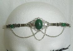 Green Agate Circlet This beautiful circlet has metal chain, sterling silver plated accents, sterling silver plated pendant and green agate settings. Adjustable. Elegant Handmade Headband Jewelry, Victorian Silver Jewelry With Adjustable Chain, Handmade Silver Headband, Adjustable Victorian Jewelry With Jewels, Victorian Adjustable Metal Jewelry, Adjustable Victorian Style Jewelry With Jewels, Victorian Style Adjustable Metal Jewelry, Adjustable Victorian Metal Jewelry, Elegant Silver Headpieces For Gifts