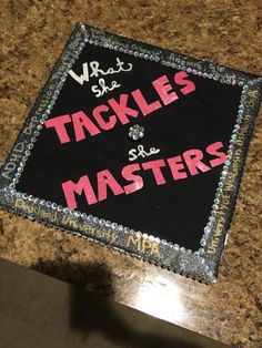 a cake that is decorated to look like it has the words tacklers and masters on it