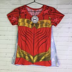 Up For Grabs Is A Brand New With Tag Dc Comics Wonder Woman Graphic Print Lightweight Short Sleeve Tee T-Shirt With Detachable Cape Women's Juniors Size Medium. Never Worn Or Used. Measurements Laying Flat Are Included In Photos, Please Compare Them To Your Own For Proper Fit! Please Refer To All Photos. Ask Any Questions Prior To Purchasing. Thanks! Red Cotton T-shirt For Fan Conventions, Fun Character Print T-shirt For Fan Conventions, Red Superhero T-shirt With Character Print, Red Superhero Short Sleeve T-shirt, Superhero Cotton T-shirt With Character Print, Red Graphic Print T-shirt For Fan Conventions, Fitted Blue T-shirt With Character Print, Superhero Short Sleeve T-shirt With Character Print, Fun Short Sleeve T-shirt With Anime Print