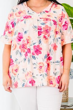 Grab this beauty while you still have a chance! This top features a lovely floral pattern and a pretty peach coral color that is sure to stand out! The flowy fit makes it perfect for a casual day out! 100% Polyester Peach Blouse For Vacation, Peach Feminine Blouse For Day Out, Feminine Peach Blouse For Day Out, Peach Blouse For Beach, Spring Season, Peach Blouse For Beach In Spring, Peach Blouse For Spring Beach Occasions, Feminine Peach Top For Spring, Summer Pink Flowy Blouse, Feminine Peach Tops For Beach