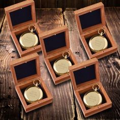 six personalized wooden boxes with key chains in them on top of a wood table