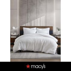 an image of a bed with white sheets and pillows in a bedroom setting that is featured on macy's website