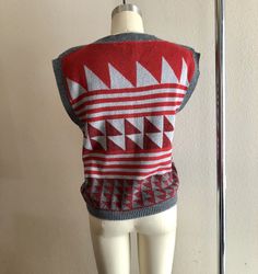 Rad 80s geometric sweater shirt/vest, maroon and gray colors. No tags but fits like a women's size small/medium. Shown here on a size 4 mannequin. Use measurements below for reference. A small discoloration spot (unnoticeable) shown in last photo. Measurements laying flat: 18.5 inches pit y 20.5 inches collar to hem Thanks for looking :) Casual Vest With Graphic Print For Fall, Casual Graphic Print Vest For Fall, Trendy Cotton Sweater Vest For Fall, Fall Cotton Crew Neck Sweater Vest, Fall Cotton Stretch Sweater Vest, Fitted Winter Sweater Vest, Fitted Sweater Vest For Winter, Graphic Print Knit Tops For Fall, Crew Neck Cotton Sweater Vest For Winter